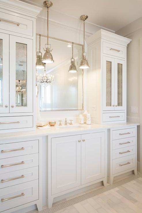 Bathroom vanity cabinets with Antiqued Mirrored Doors .