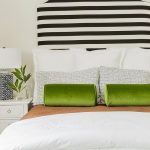 Black and White Striped Headboard with Green Velvet Bolster .