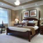 Great master bedroom: Wall color (with white molding); dark wood .