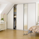 Sliderobes fitted sliding door wardrobes in white ash & mirror .