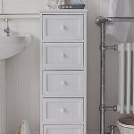 A crisp white freestanding cottage bathroom storage furniture. A .