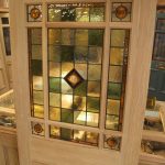 An interior door design with simple pattern stained glass panel in .
