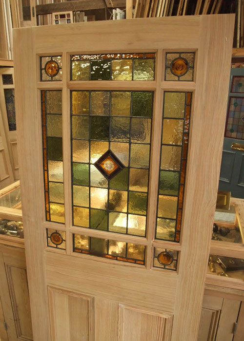 An interior door design with simple pattern stained glass panel in .