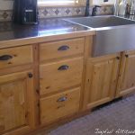 Rustic kitchen, knotty pine kitchen cabinets, stainless steel .