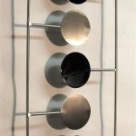 Contemporary metal wall art sculpture - gloss black and brushed .