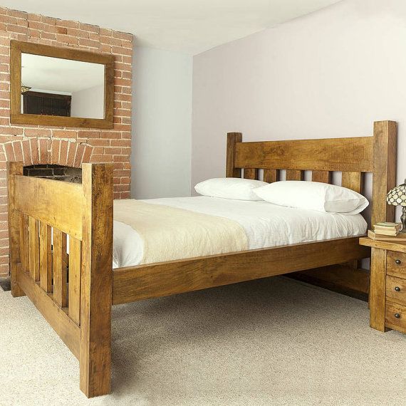 Handmade chunky solid wood plank post slatted bed frame in single .