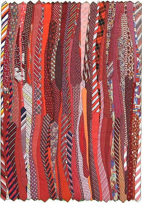 A rug made of recycled neck ties -...could easily become a quilt .