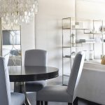 Gray Upholstered Chairs at Round Black Dining Table - Transitional .