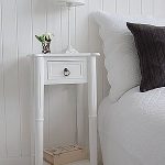 Tall, narrow bedside table to go with tall bed. New England white .