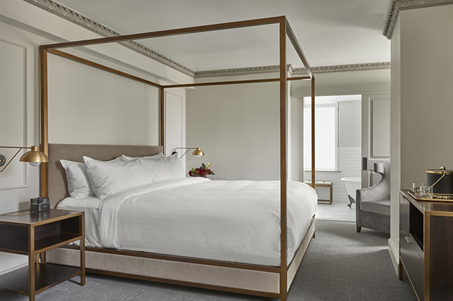 modern golden four-poster bed