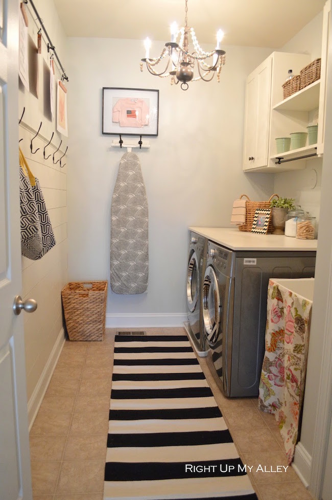 striped carpet chandelier small laundry room