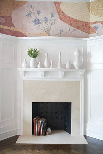 white objects on fireplace mantle