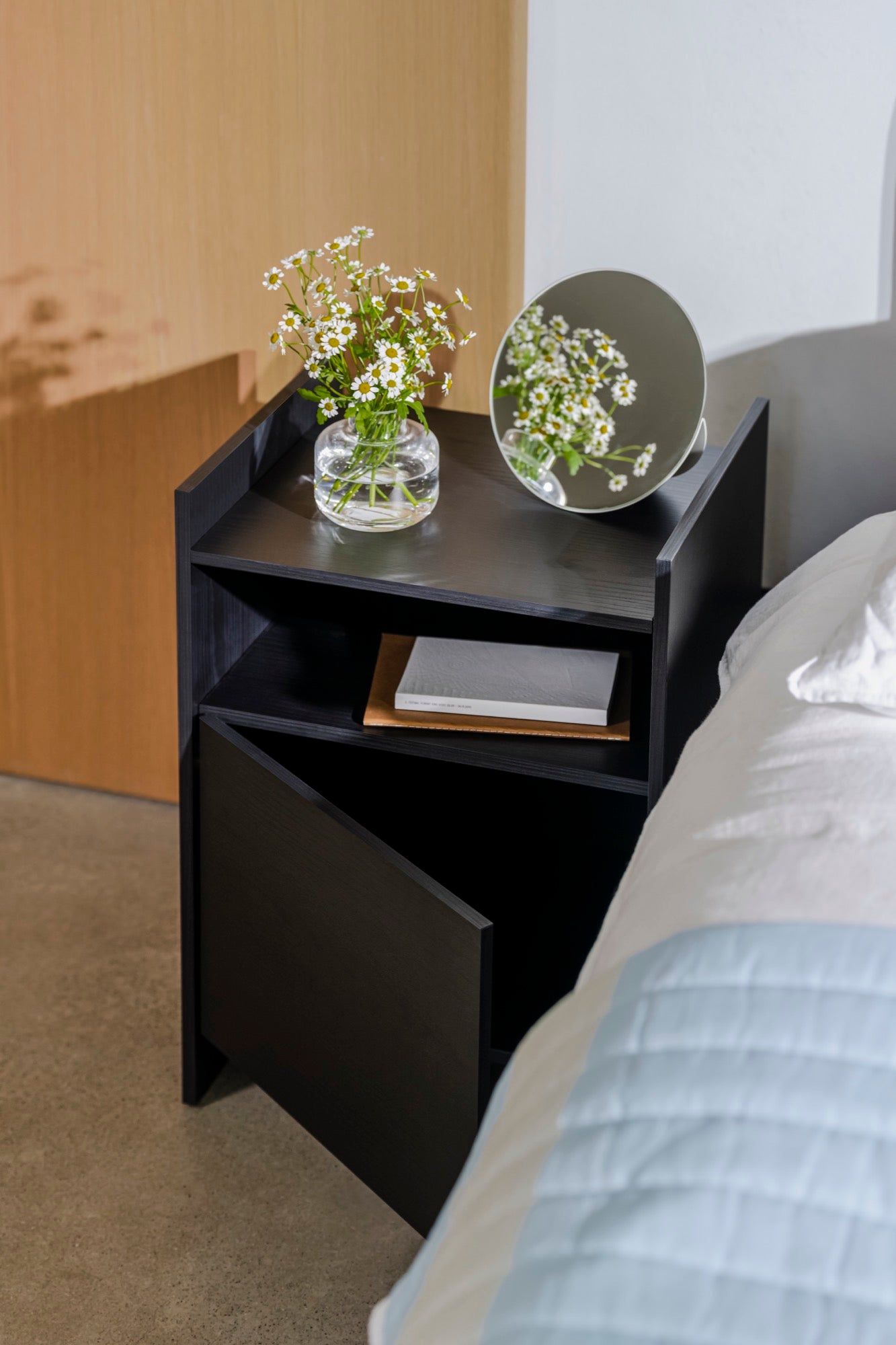 A Compact Black Nightstand for Bedroom Décor