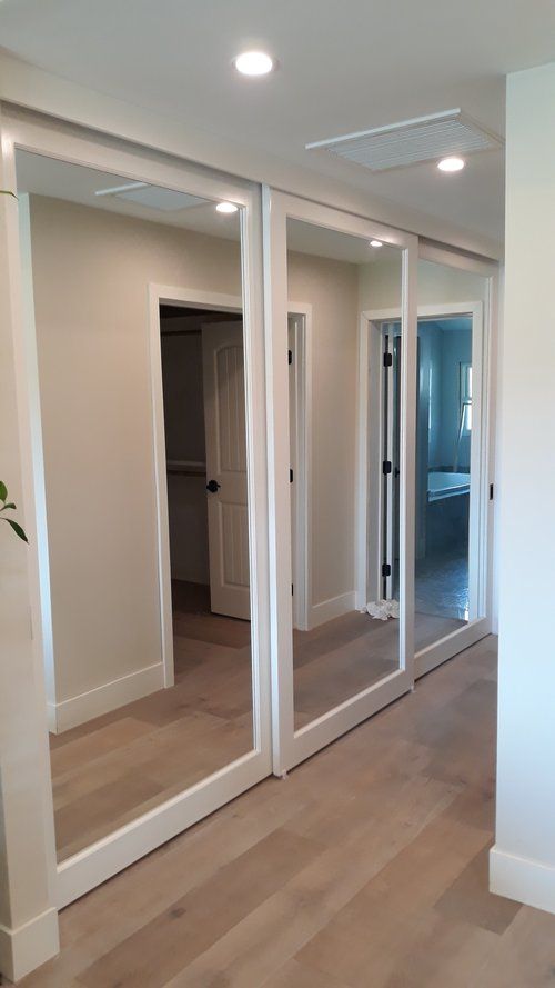 Reflective Sliding Closet Doors: A Stylish and Practical Solution for Your Bedroom