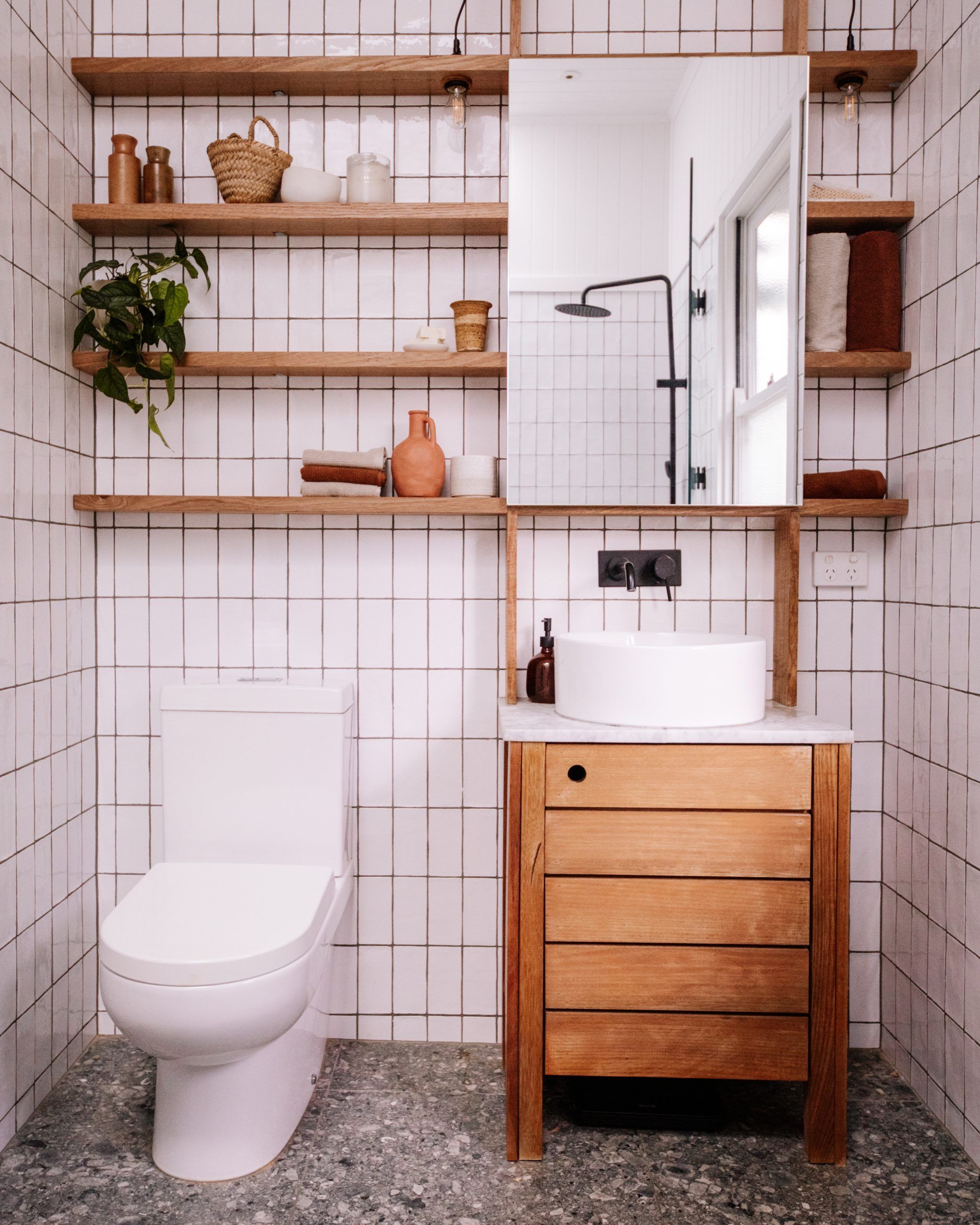 Utilizing Vertical Wall Space for Bathroom Storage