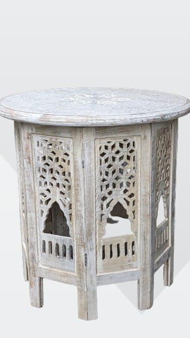 Discovering LEATHEROOZE: Our Elegant Hand-Carved Accent Table