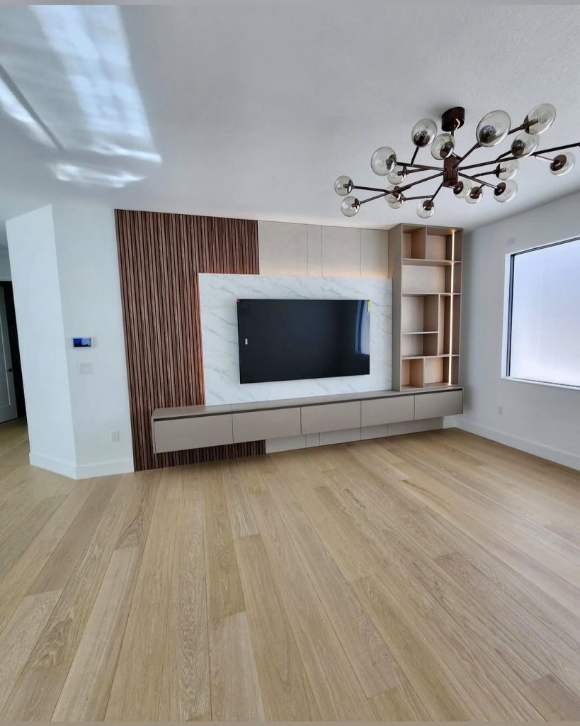 Wide plank wood flooring in bright living room