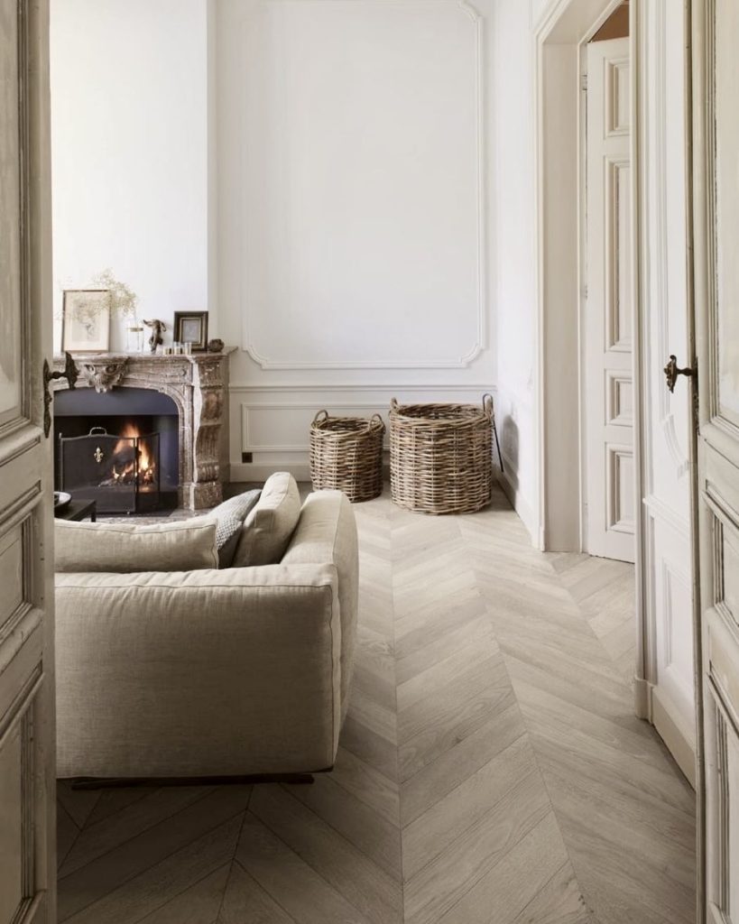 Pale chevron flooring in French country style room
