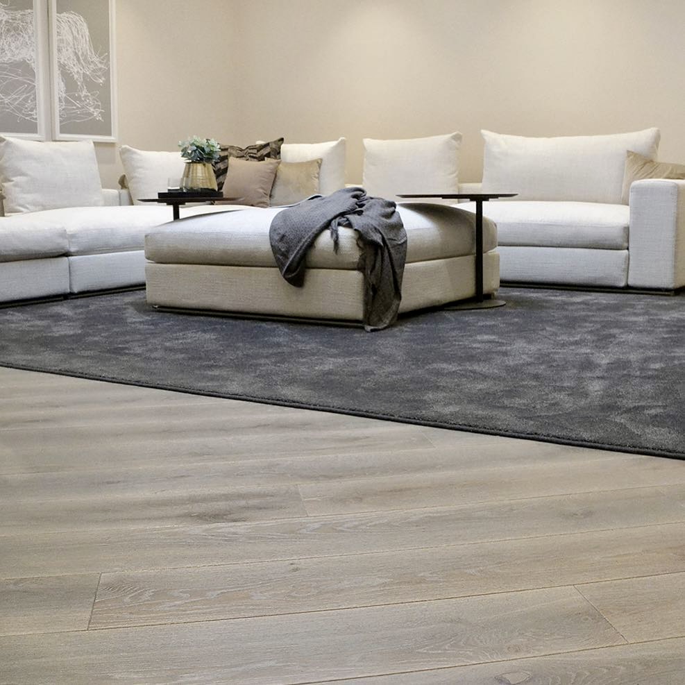 Cool-toned flooring with plush sectional