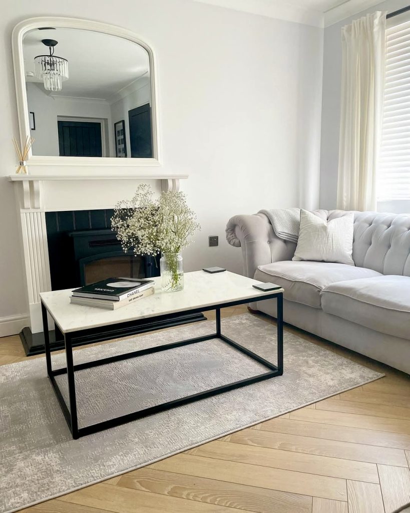 Light-toned parquet flooring with velvet sofa