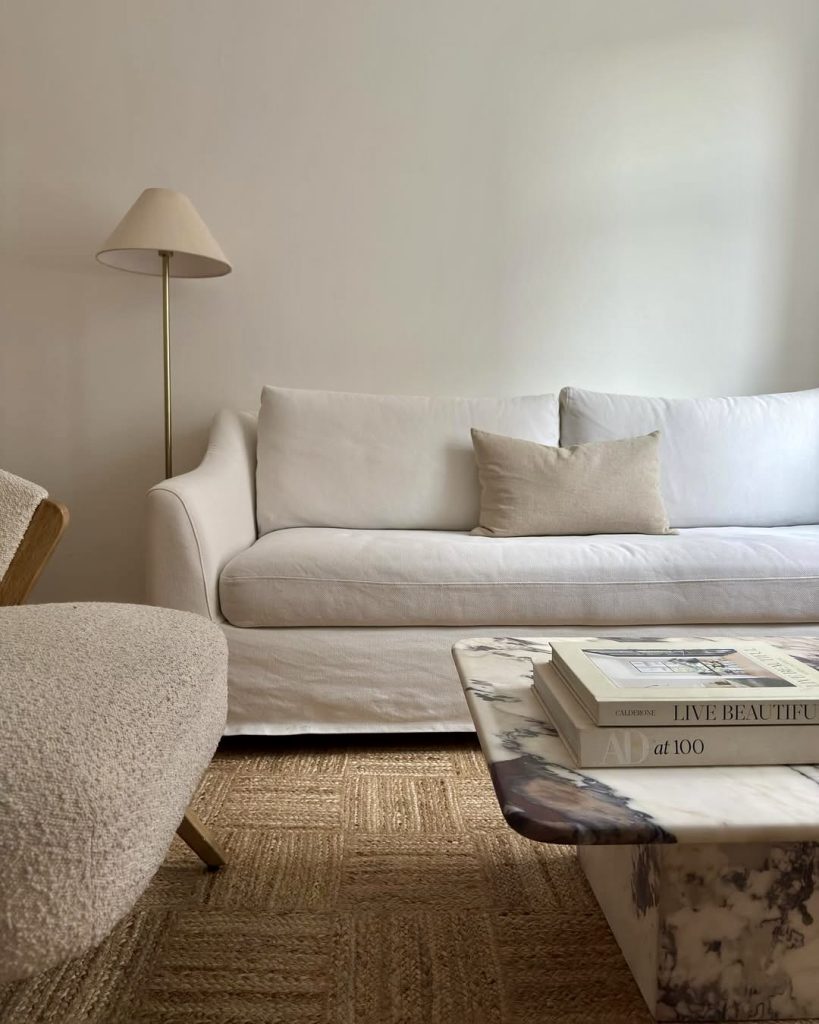 White linen sofa with beige accents and natural decor