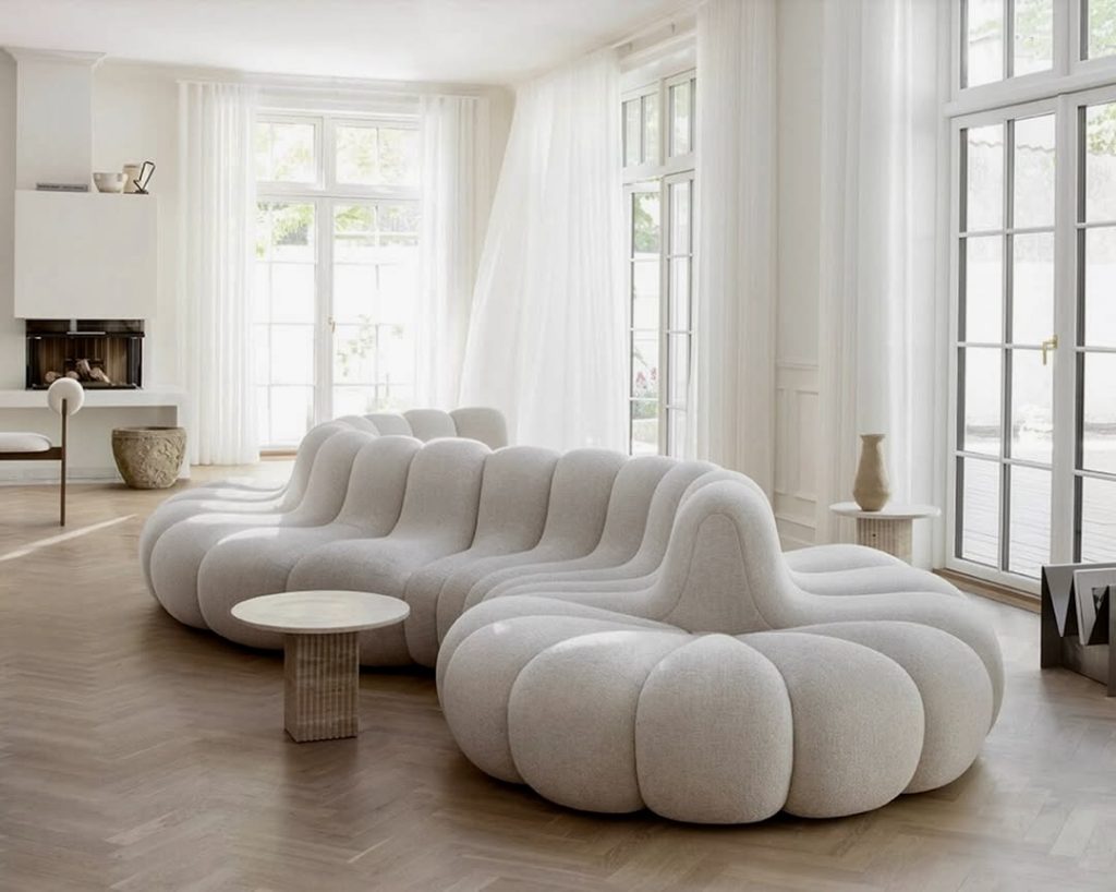 Curved white sofa with plush lines in bright room