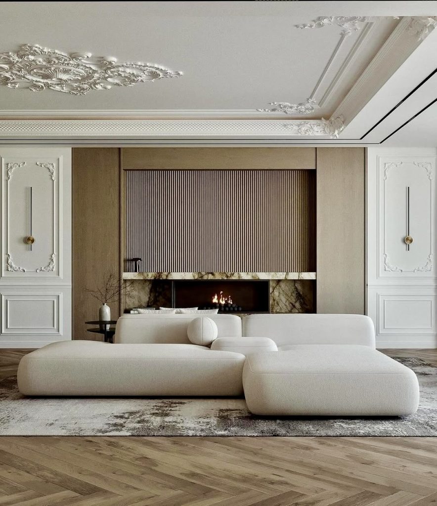 Neutral white sofa in room with marble fireplace and detailed ceiling