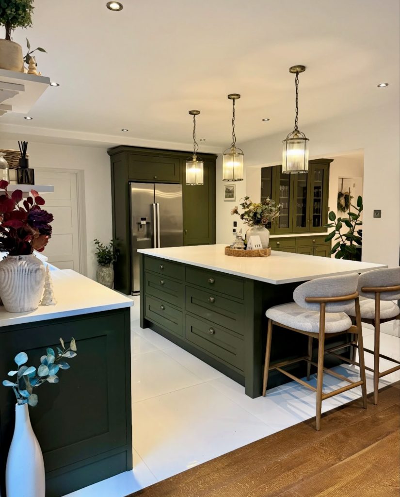 Bold Deep Green Kitchen Cabinets with White Countertops