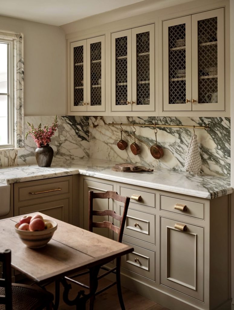 Kitchen with Dramatic Marble and Brass Accents
