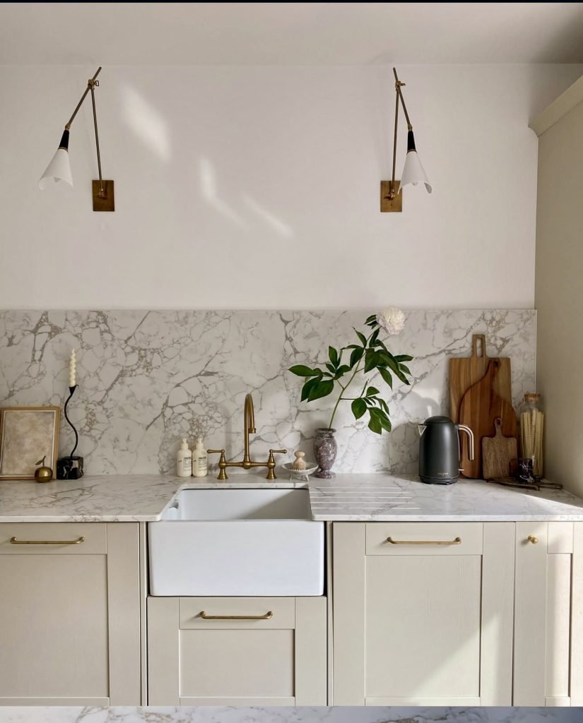 Kitchen with Sculptural Lighting and Marble
