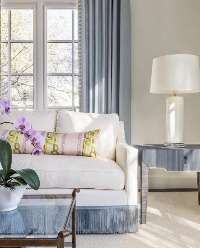 Modern blue and white living room with orchid pink pillow