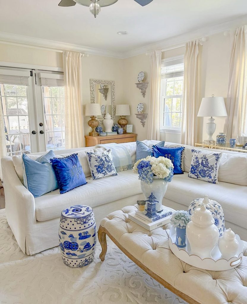 Coastal blue and white living room with navy pillows
