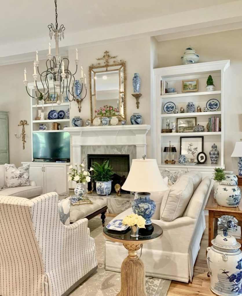 Classic blue and white living room with porcelain and gold accents