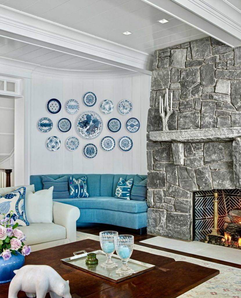 Living room with stone fireplace and blue accents