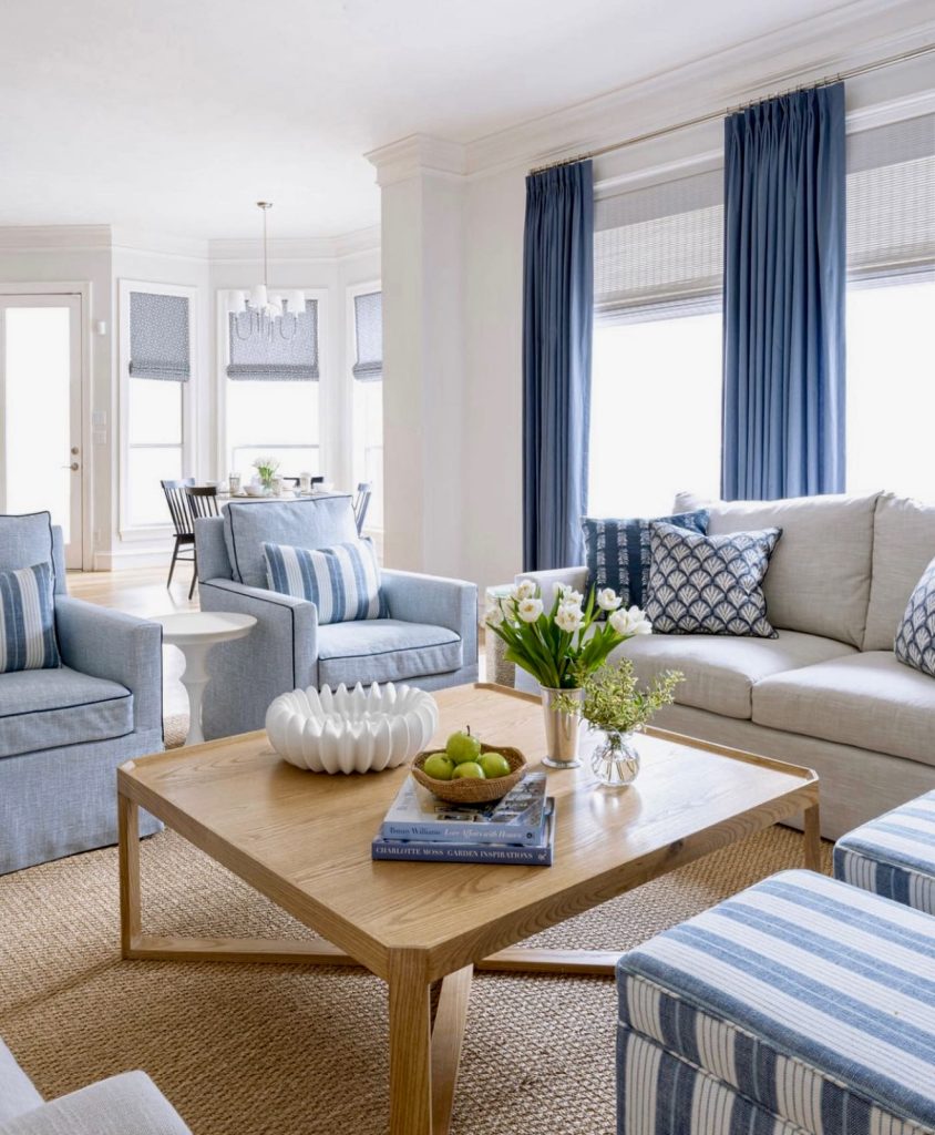 Blue and white striped sofa with woven carpet