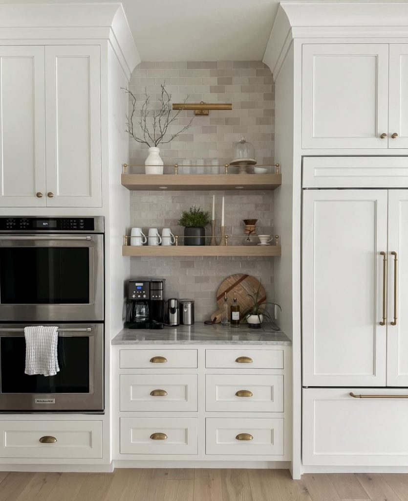 Built-in coffee nook with white cabinets and wooden shelves