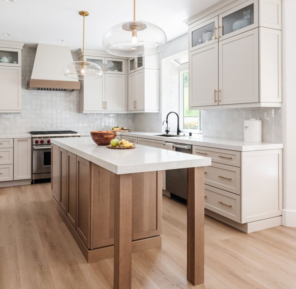 Modern farmhouse kitchen with white and wood cabinetry
