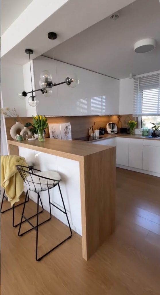 Scandinavian kitchen with butcher block and white cabinets