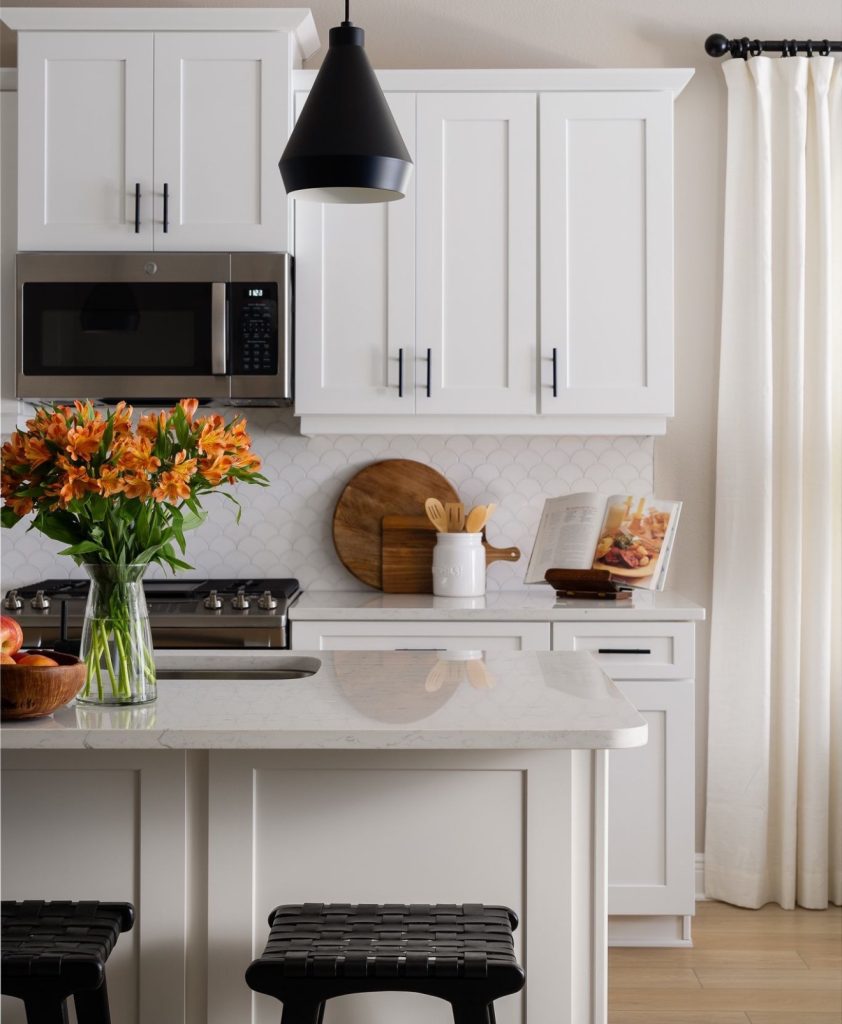 Small kitchen with white cabinets and matte black hardware