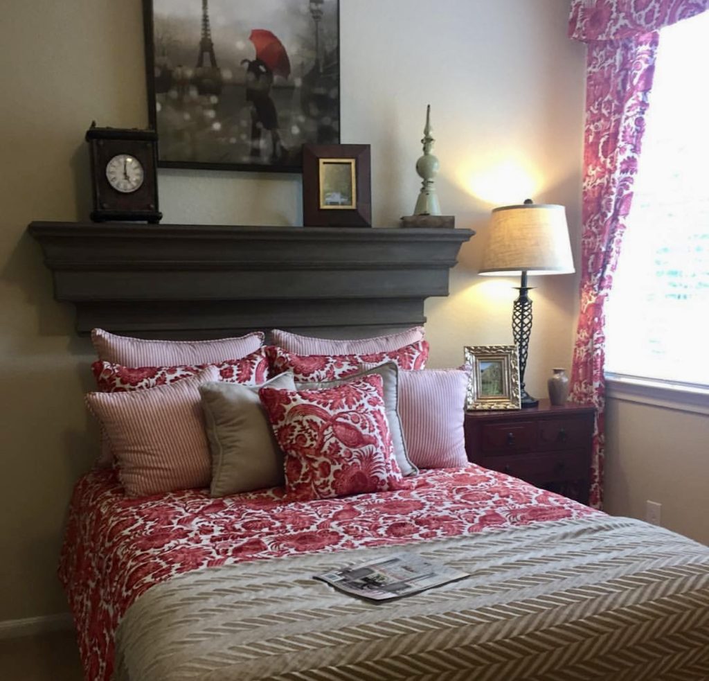 Fireplace mantel used as headboard alternative