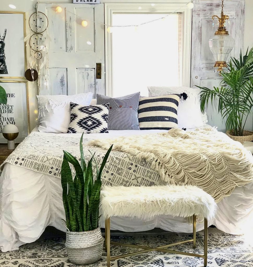 Layered pillows against vintage doors