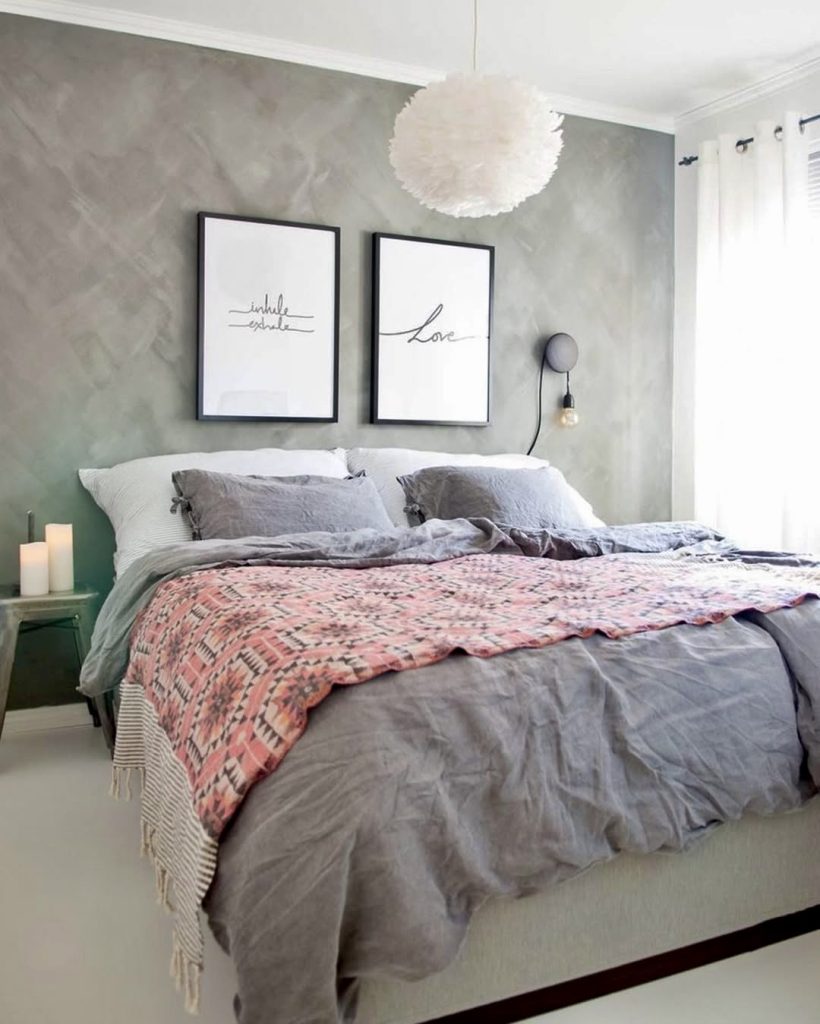 Framed quotes on brushed grey wall