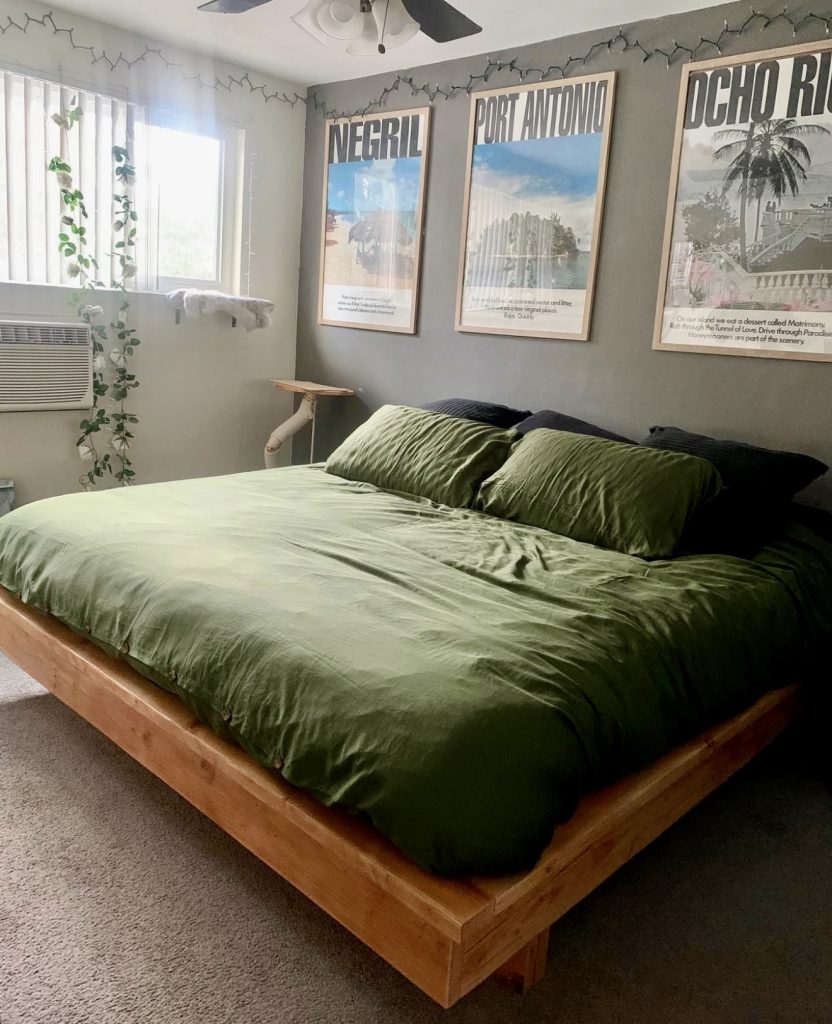 Green platform bed with travel posters