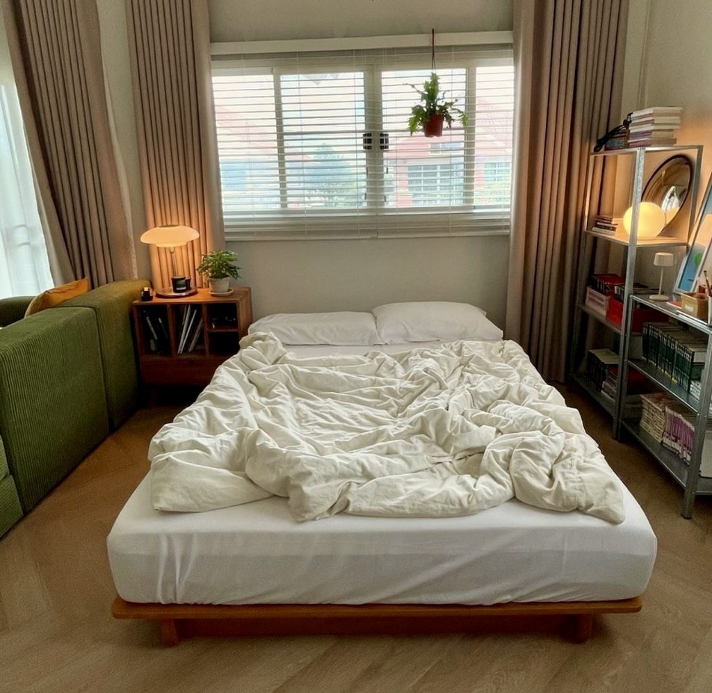Relaxed no headboard bedroom with plants