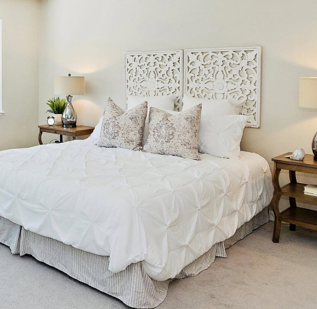 Vintage-inspired bedroom with carved panels