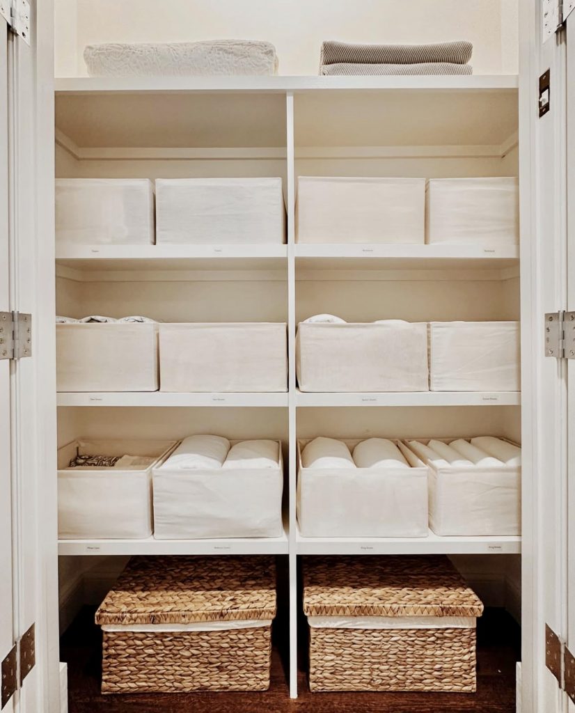 Minimalist linen closet with fabric bins