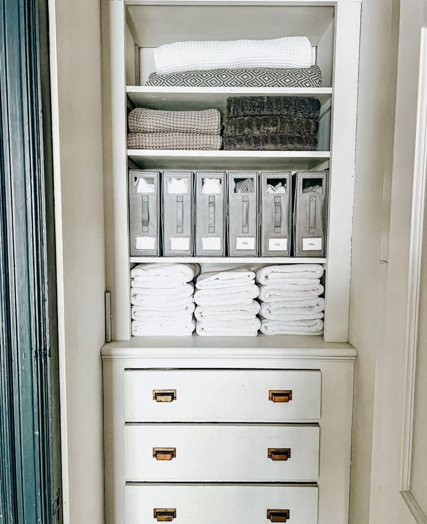 Linen closet with vertical magazine holders