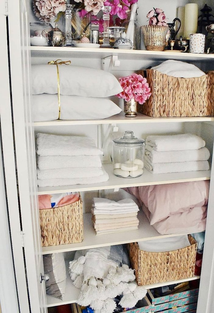Vintage-style linen closet with decorative elements