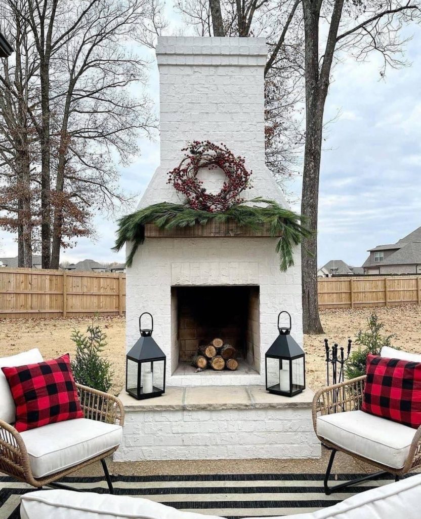 Outdoor patio fireplace decorated for holidays