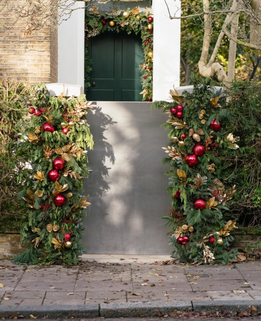 Entryway with red and gold Christmas decorations